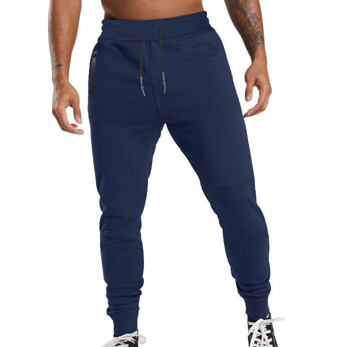 Men's black sporty joggers with functional side pockets and drawstring waistband