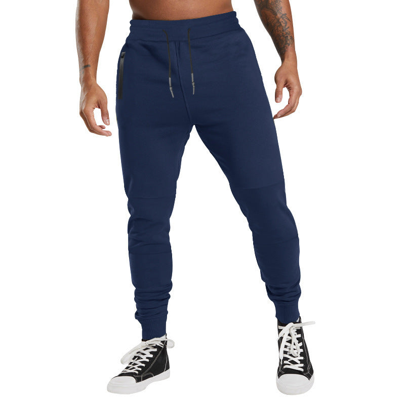 Men's black sporty joggers with functional side pockets and drawstring waistband