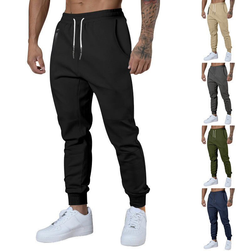 Men's black sporty joggers with functional side pockets and drawstring waistband