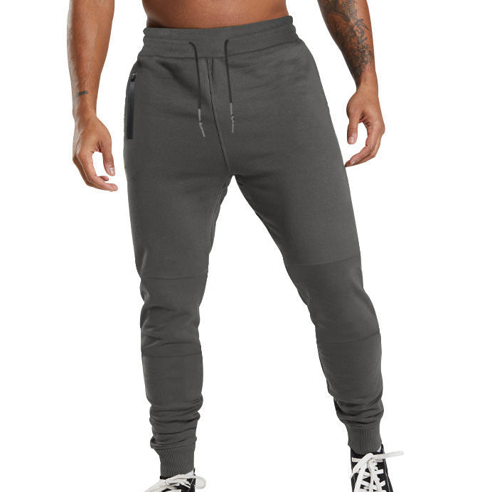 Men's black sporty joggers with functional side pockets and drawstring waistband