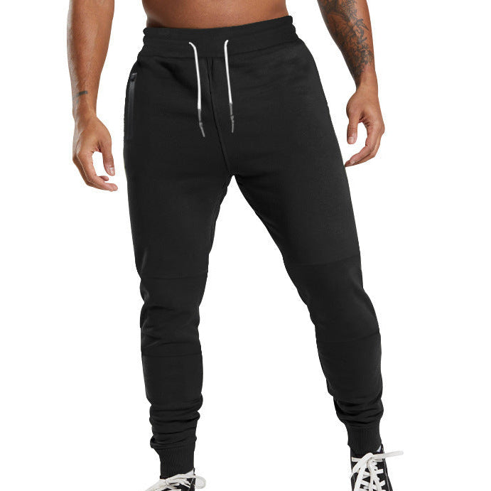 Men's black sporty joggers with functional side pockets and drawstring waistband