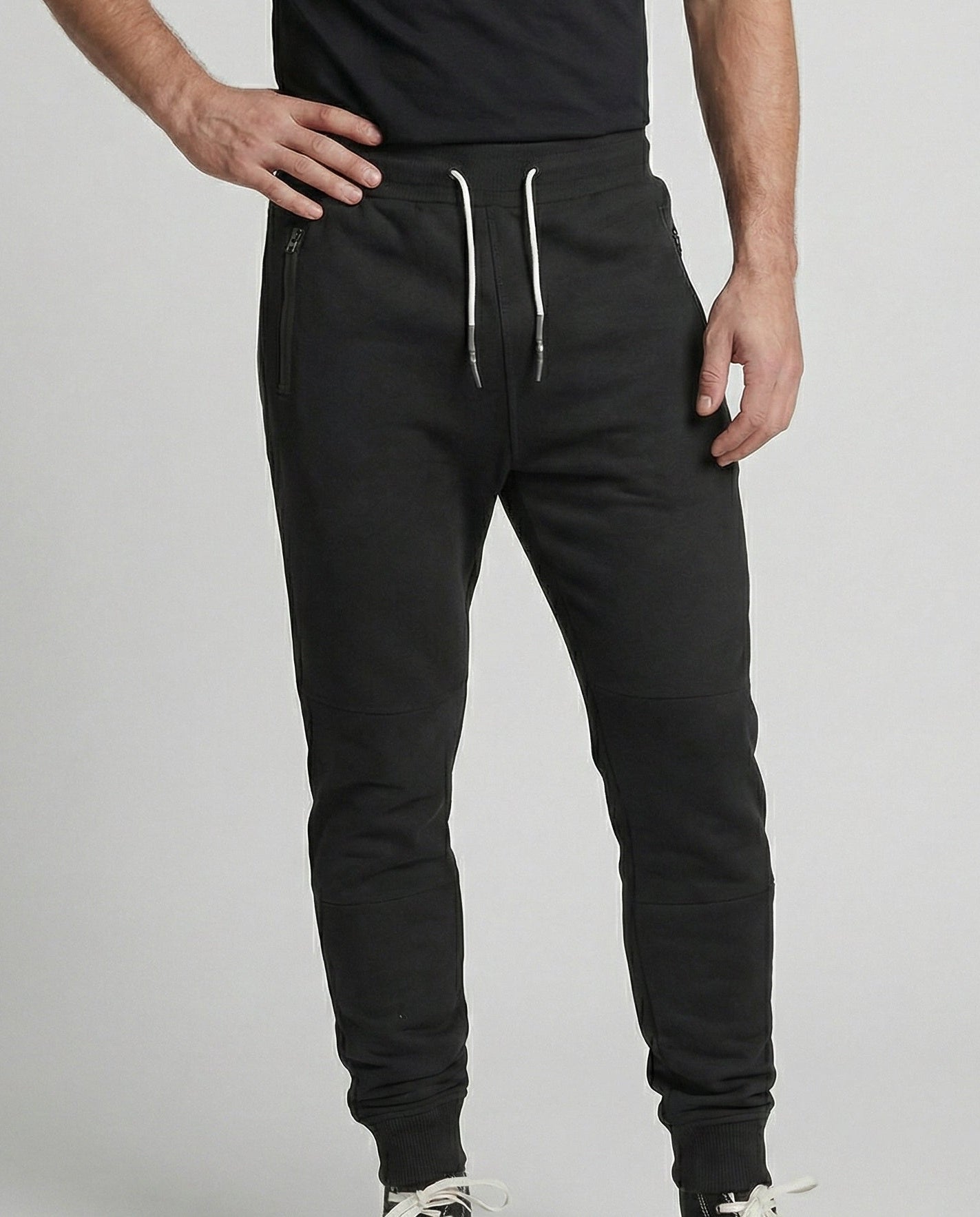 Men's black sporty joggers with functional side pockets and drawstring waistband