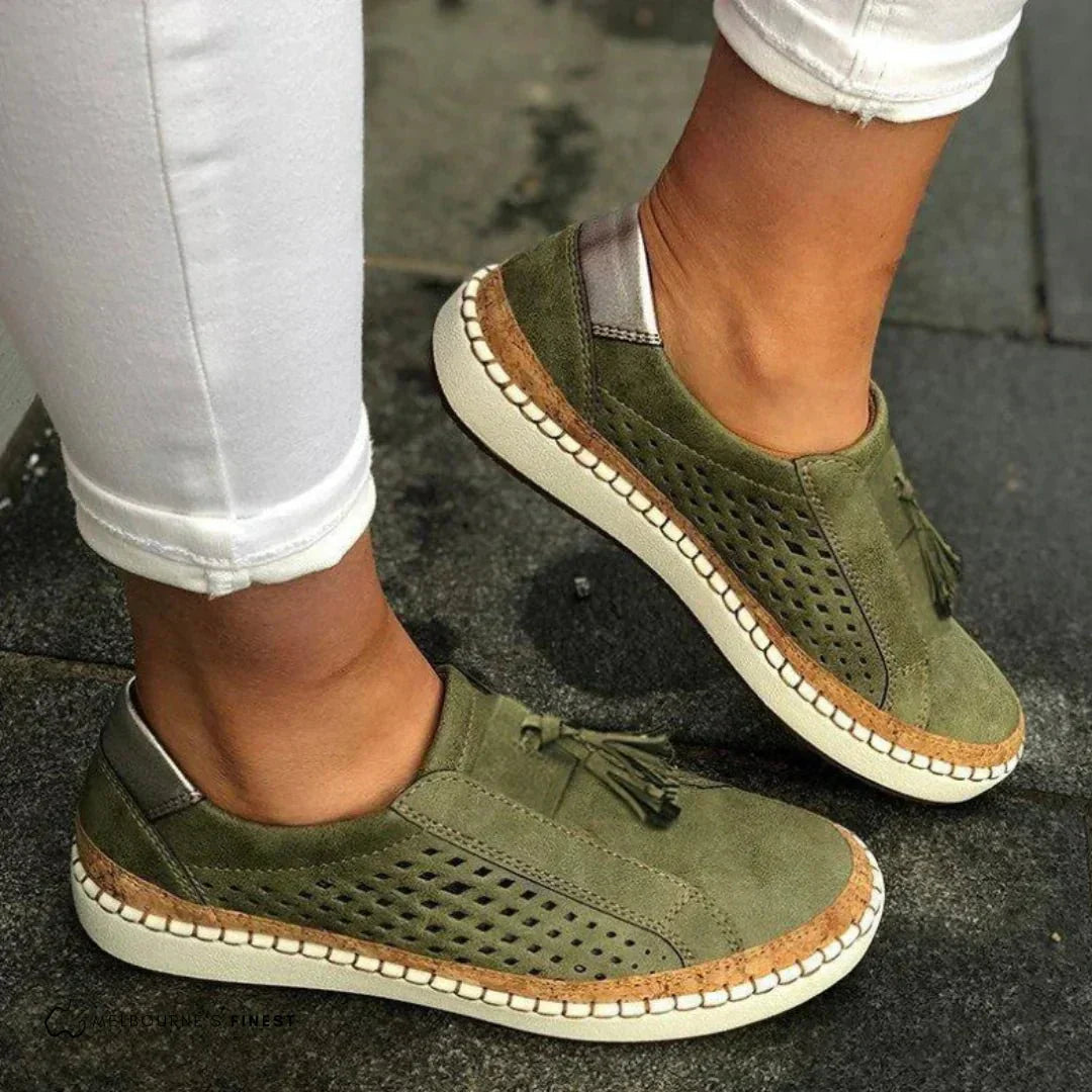 Green textured slip on loafers with reinforced stitching and a low flat sole