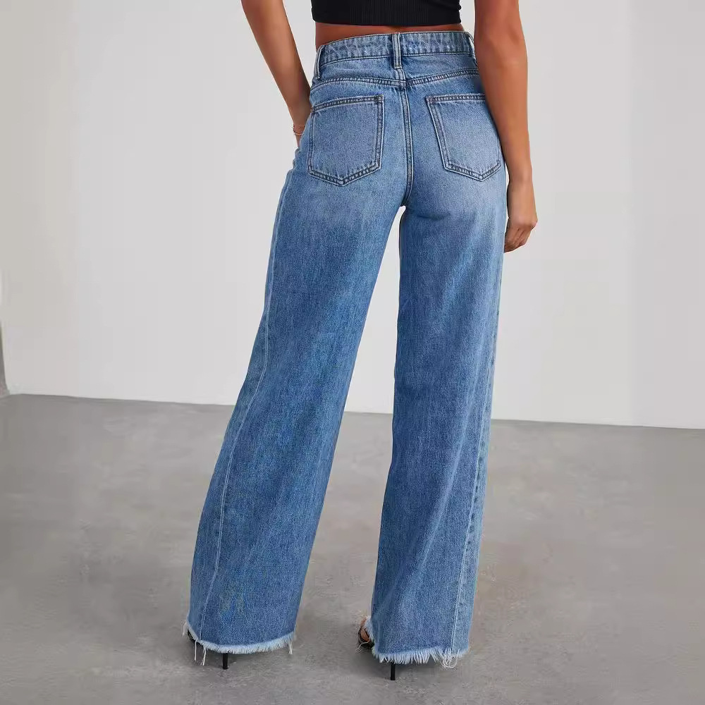 Blue wide leg high waisted jeans with a long flowing leg and classic denim finish