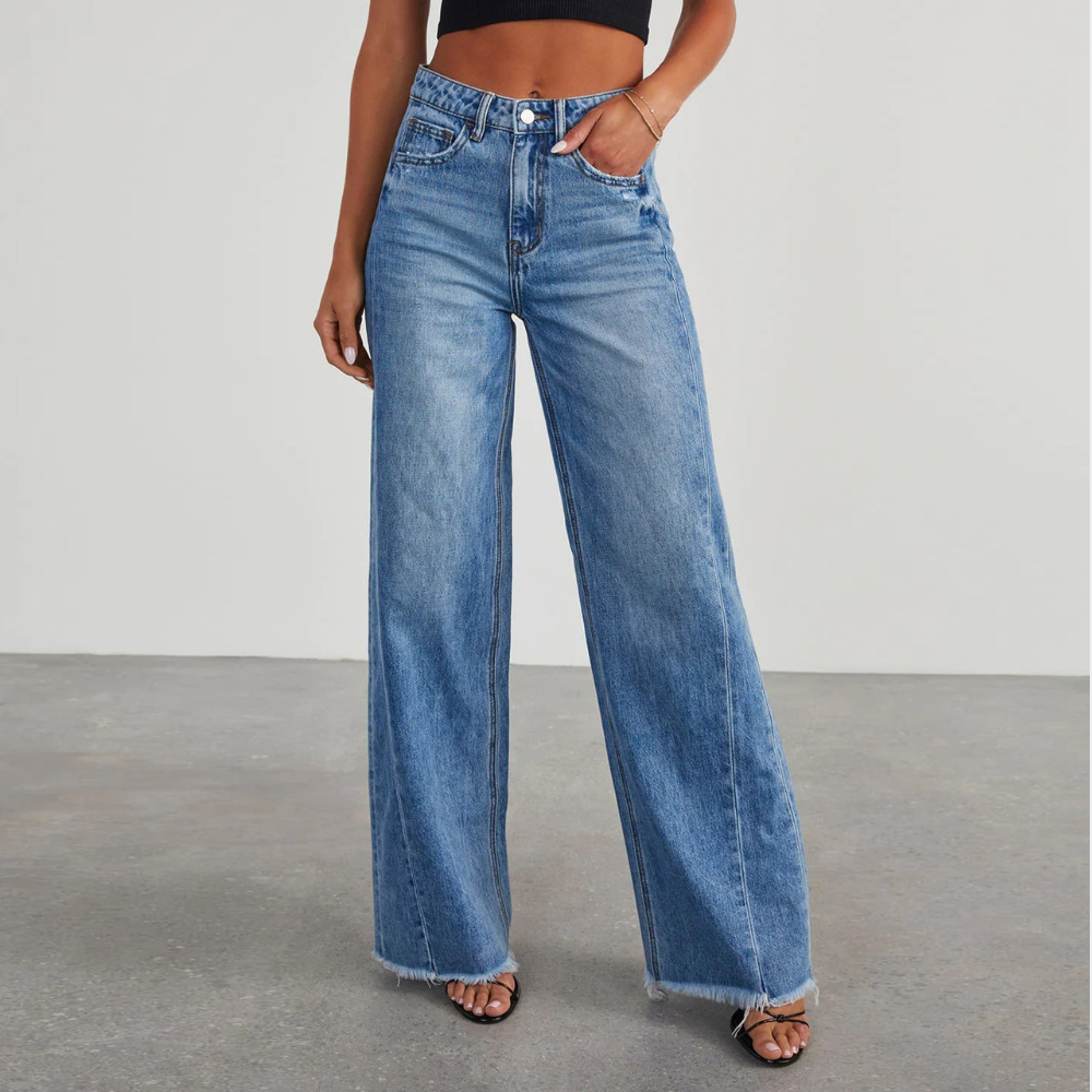 Blue wide leg high waisted jeans with a long flowing leg and classic denim finish